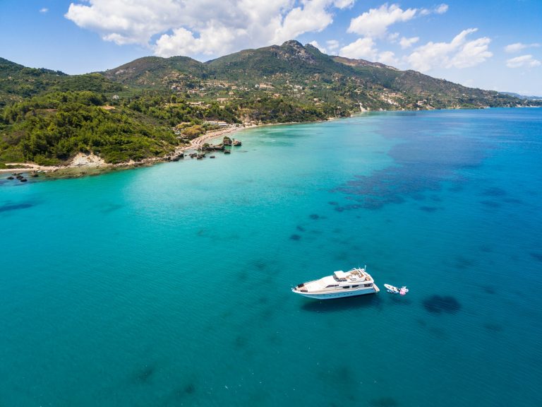 Aerial view of a boat mooring in Porto Zorro Azzurro beach in