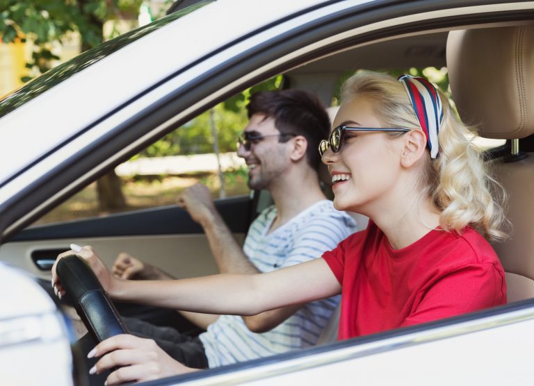 Happy couple in car